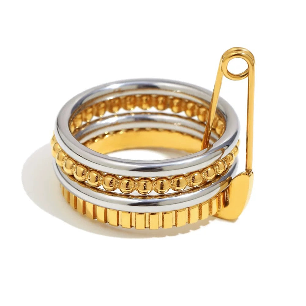 Stack of gold and silver rings on a white background