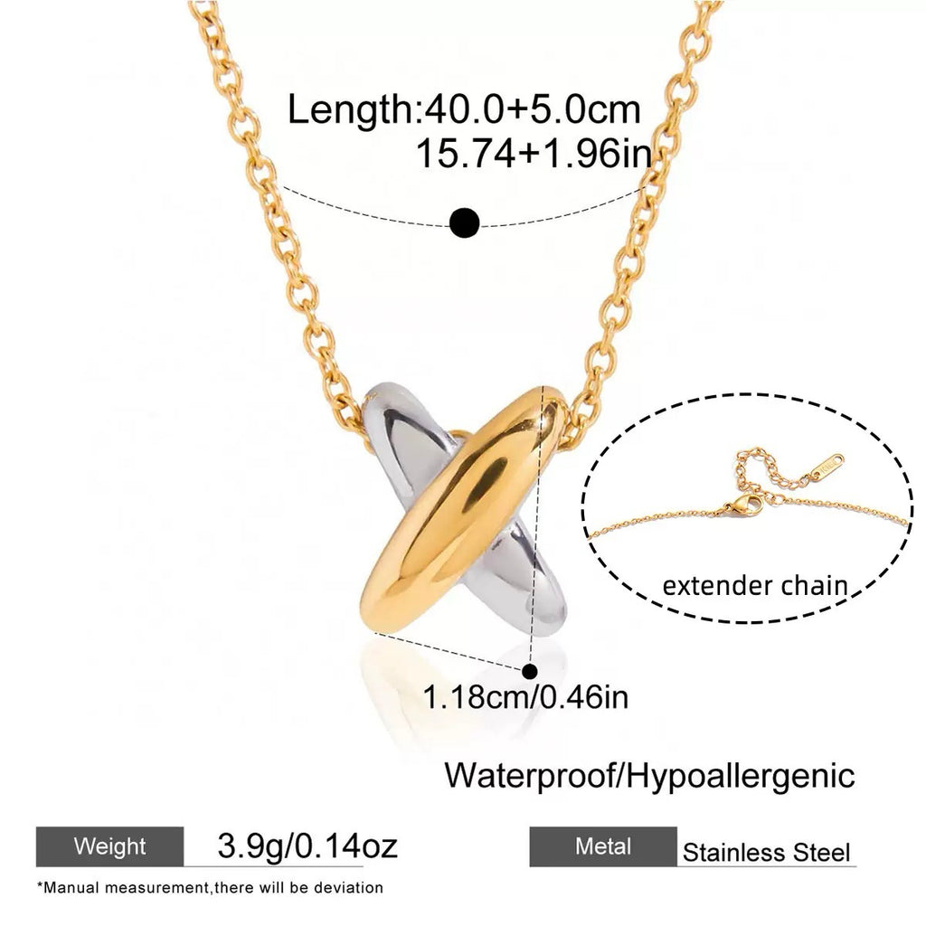 Gold and silver necklace with extender chain on a white background