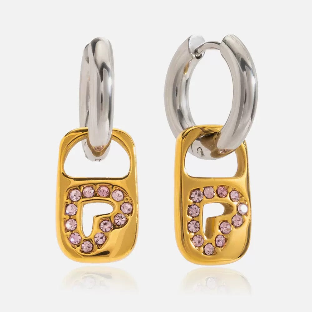 Pair of hoop earrings with gold padlock design and pink gemstones on a white background