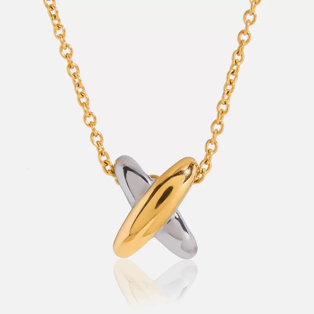 Gold and silver necklace on a white background