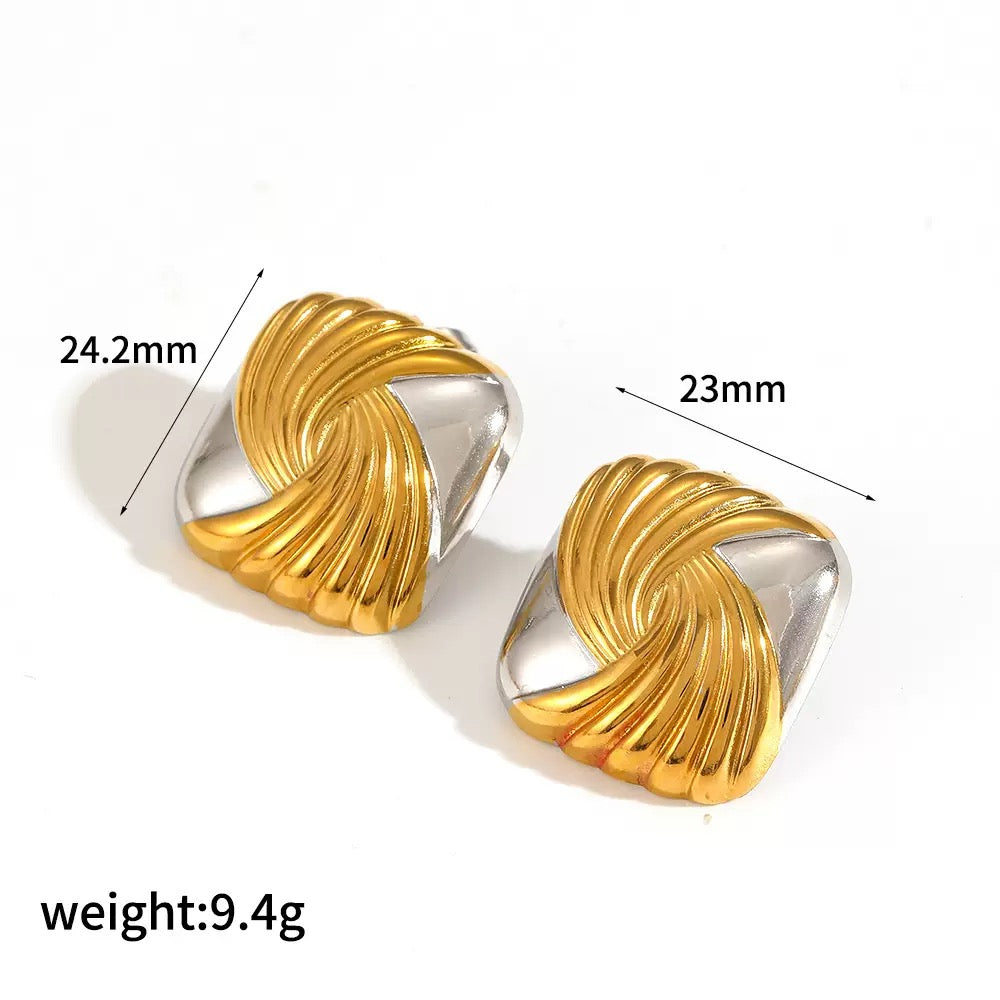 Gold and silver earrings with measurements on a white background