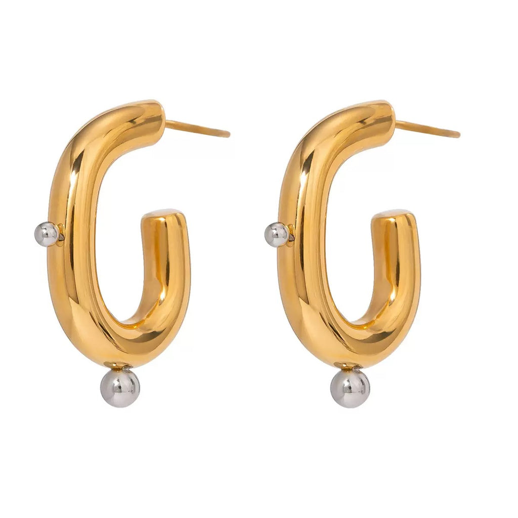 Gold hoop earrings with small silver beads on a white background