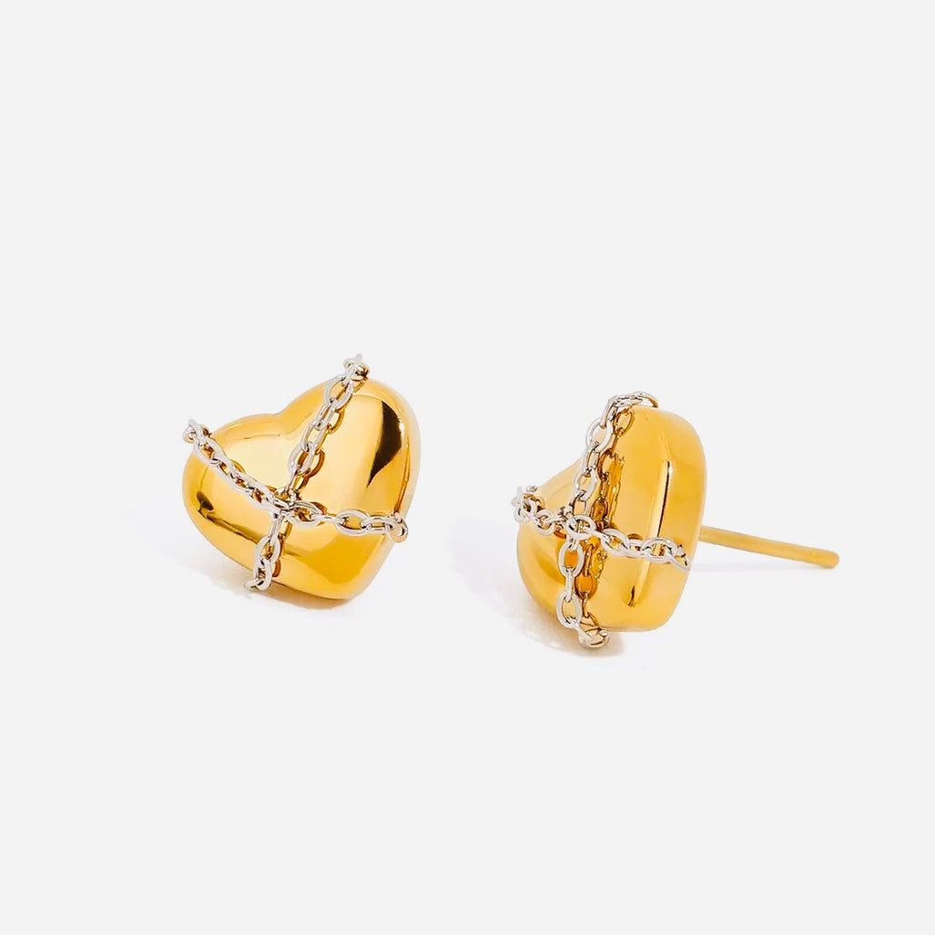 Gold heart-shaped earrings with chain details on a white background