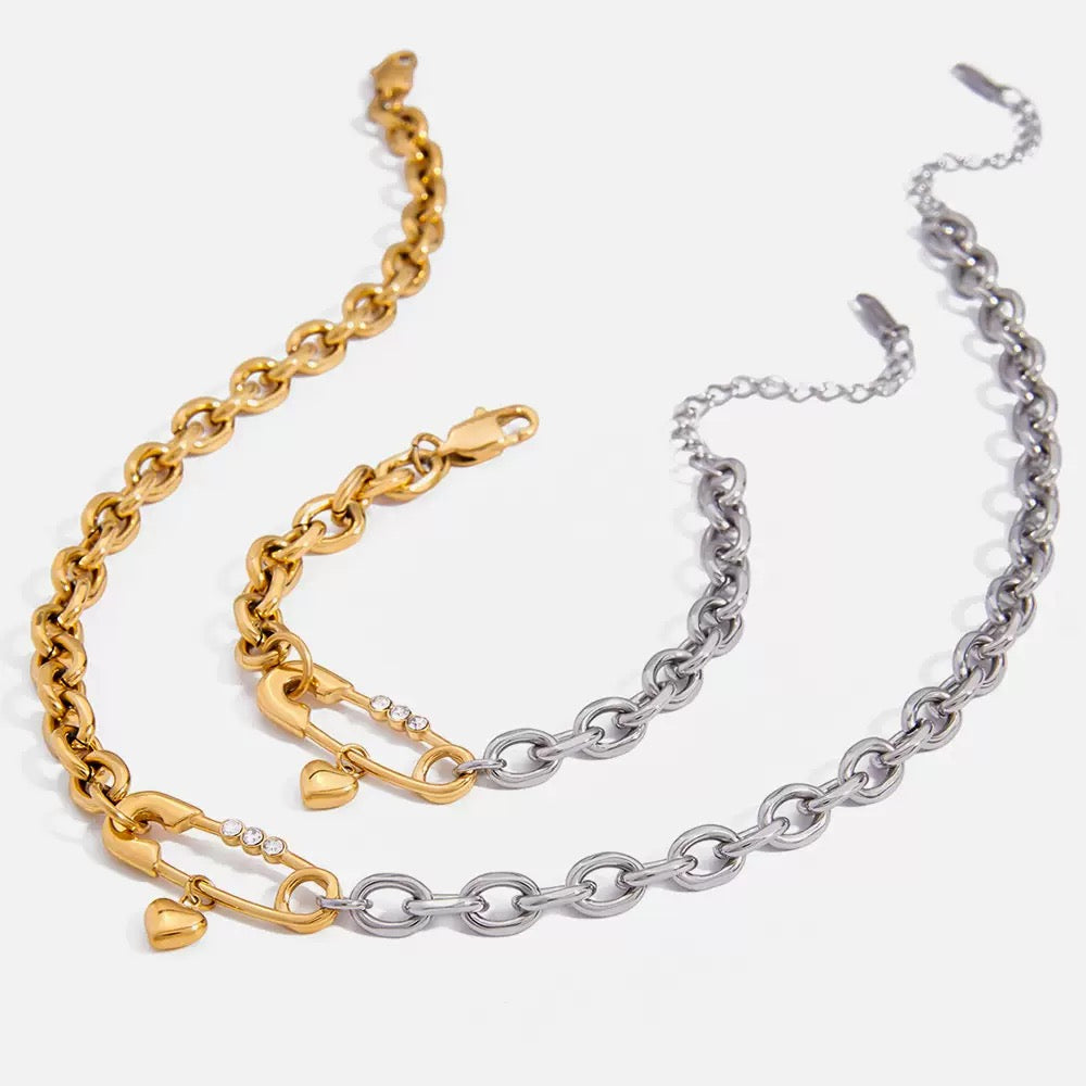 Gold and silver chain bracelets on a white background