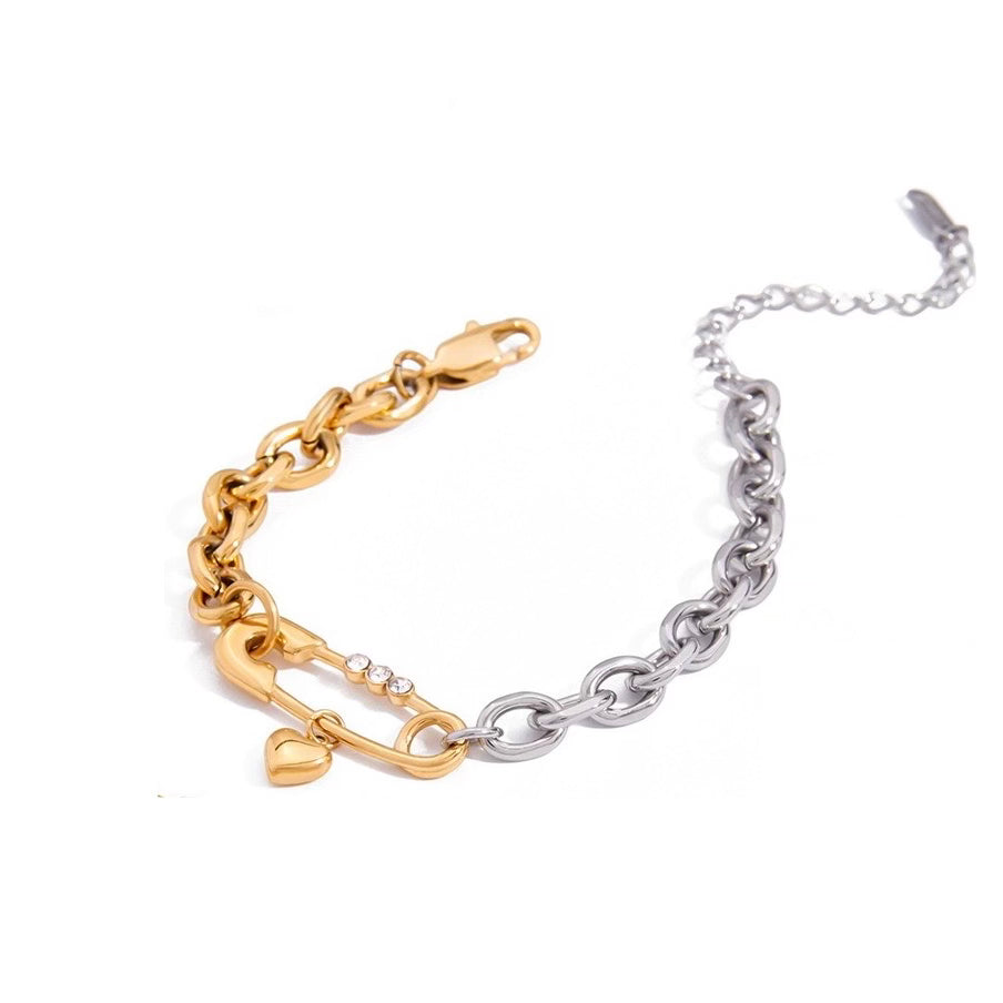 Two-tone gold and silver chain bracelet on a white background