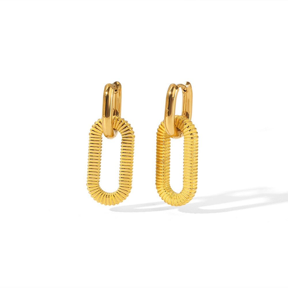 Pair of gold hoop earrings on a white background