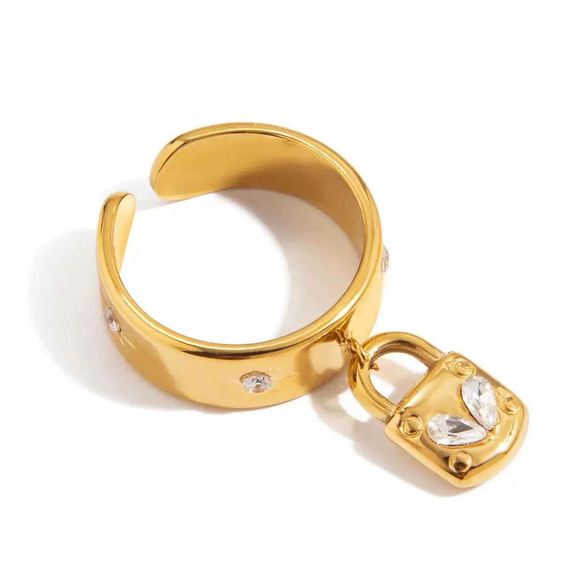 Gold hoop earring with a lock charm on a white background