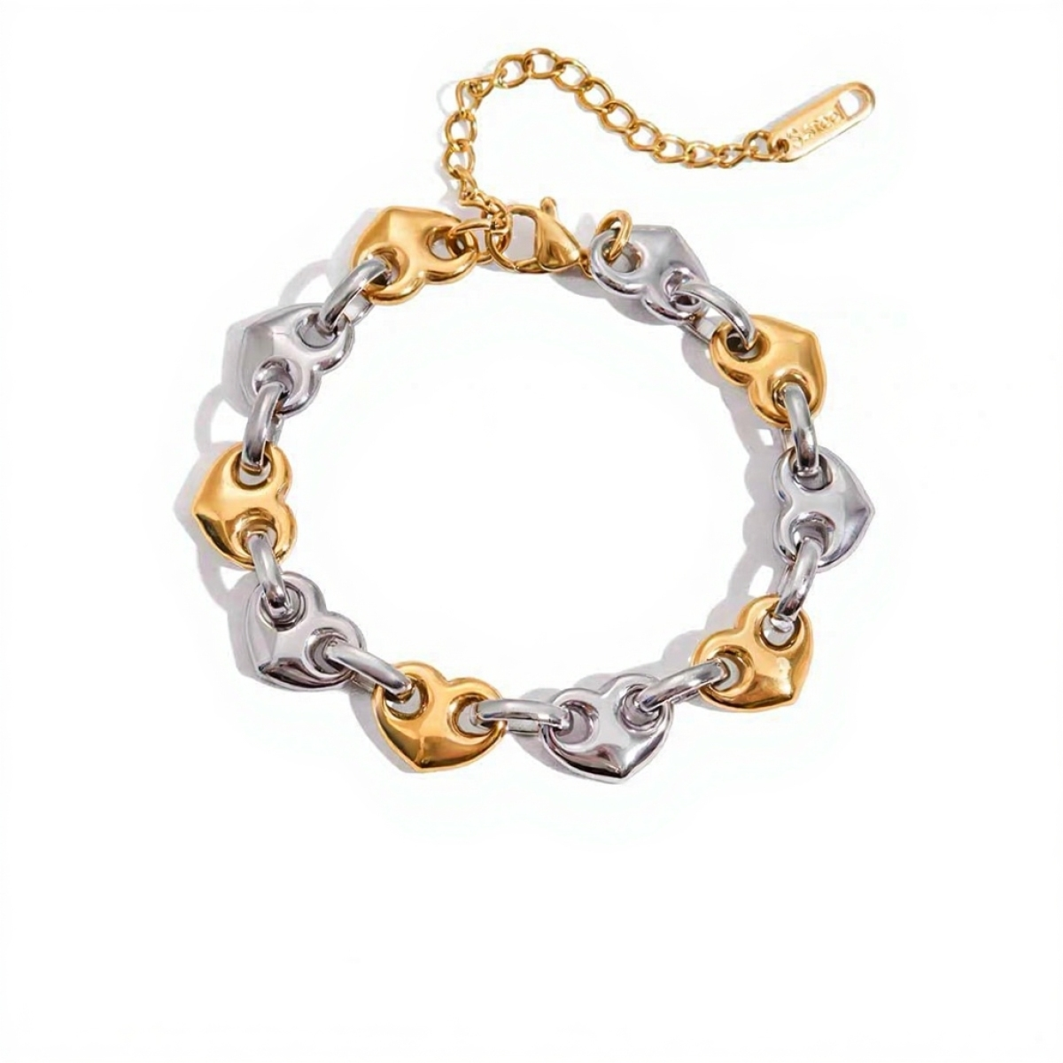 Bracelet with gold and silver heart-shaped links on a white background