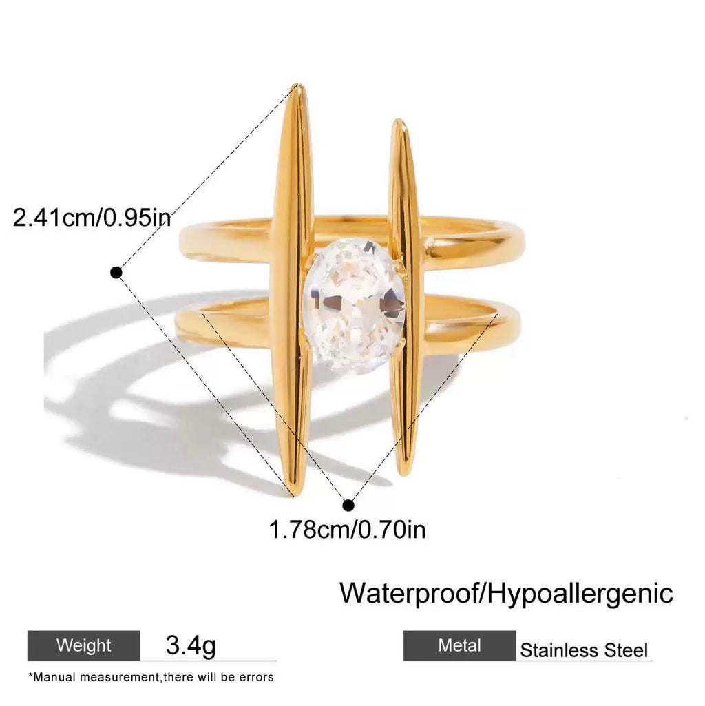 Gold ring with a clear gemstone, showing measurements and material details on a white background.