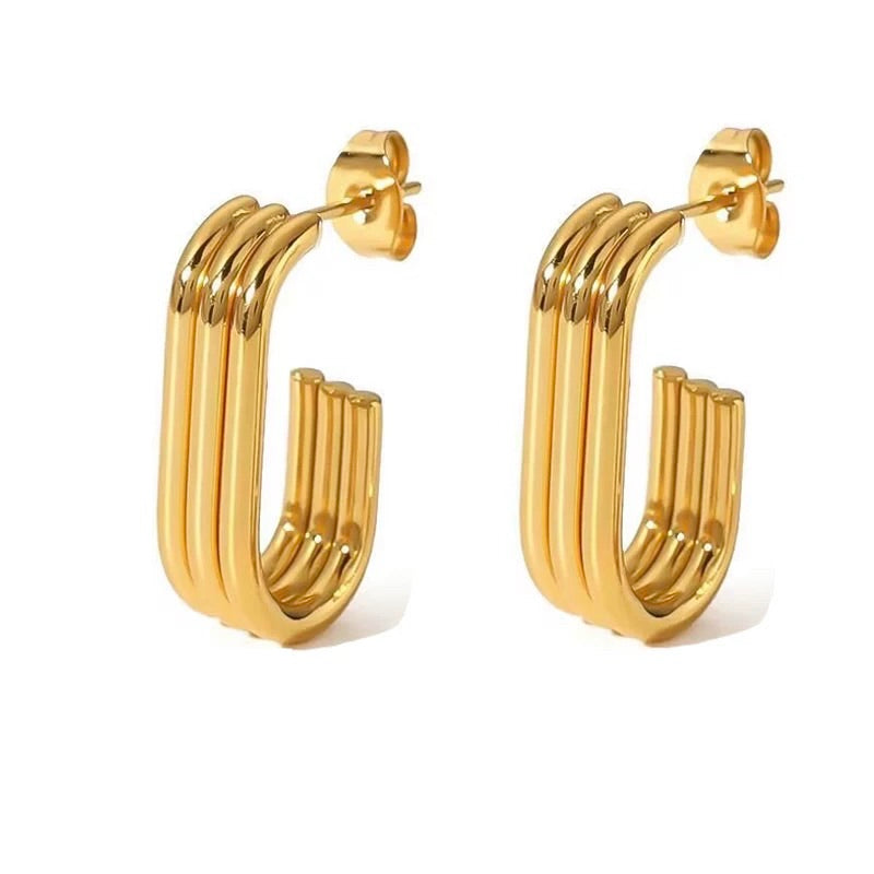 Gold hoop earrings on a white background