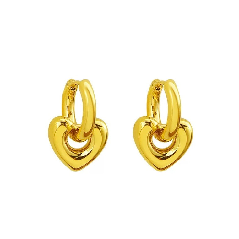Gold heart-shaped hoop earrings on a white background