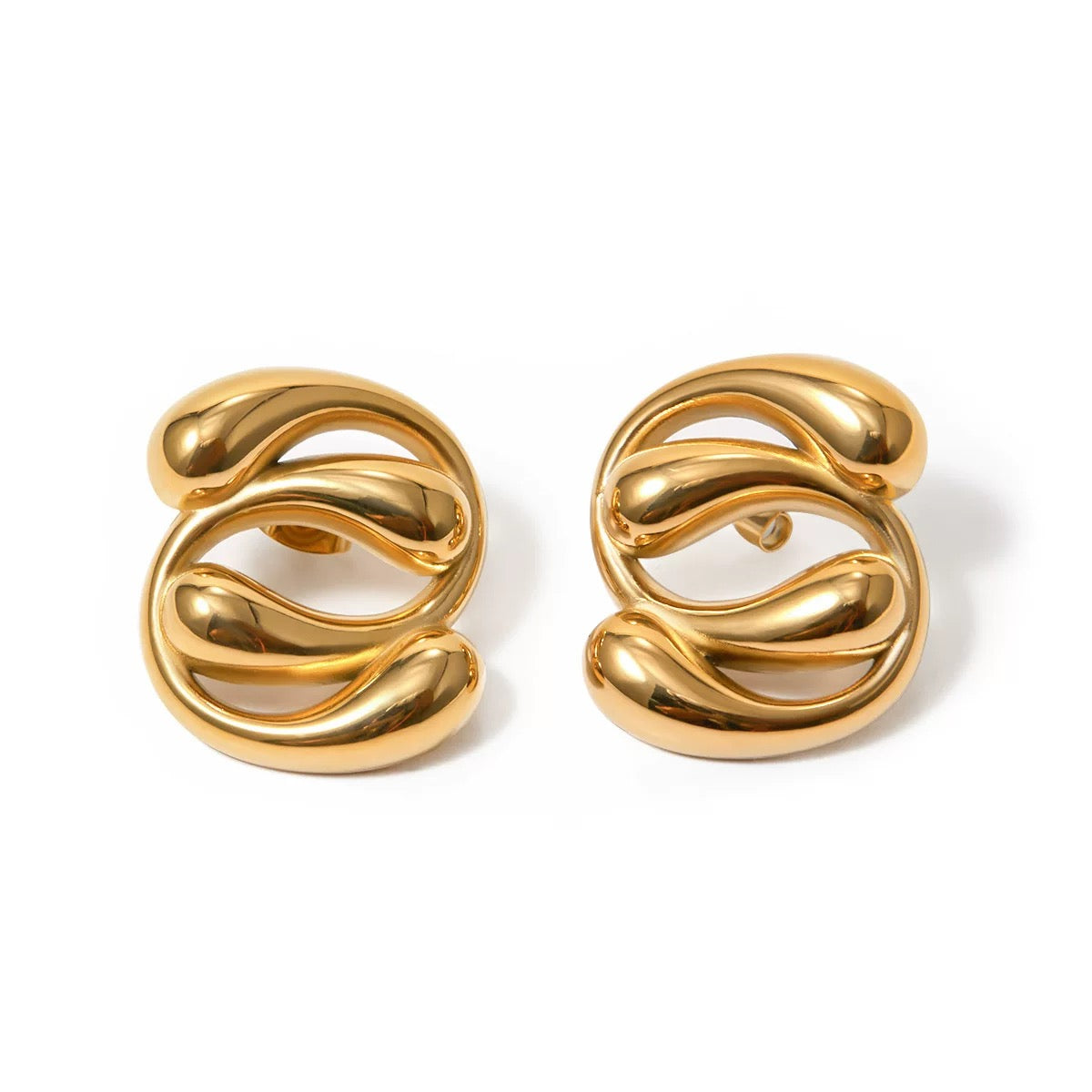 Pair of gold spiral earrings on a white background