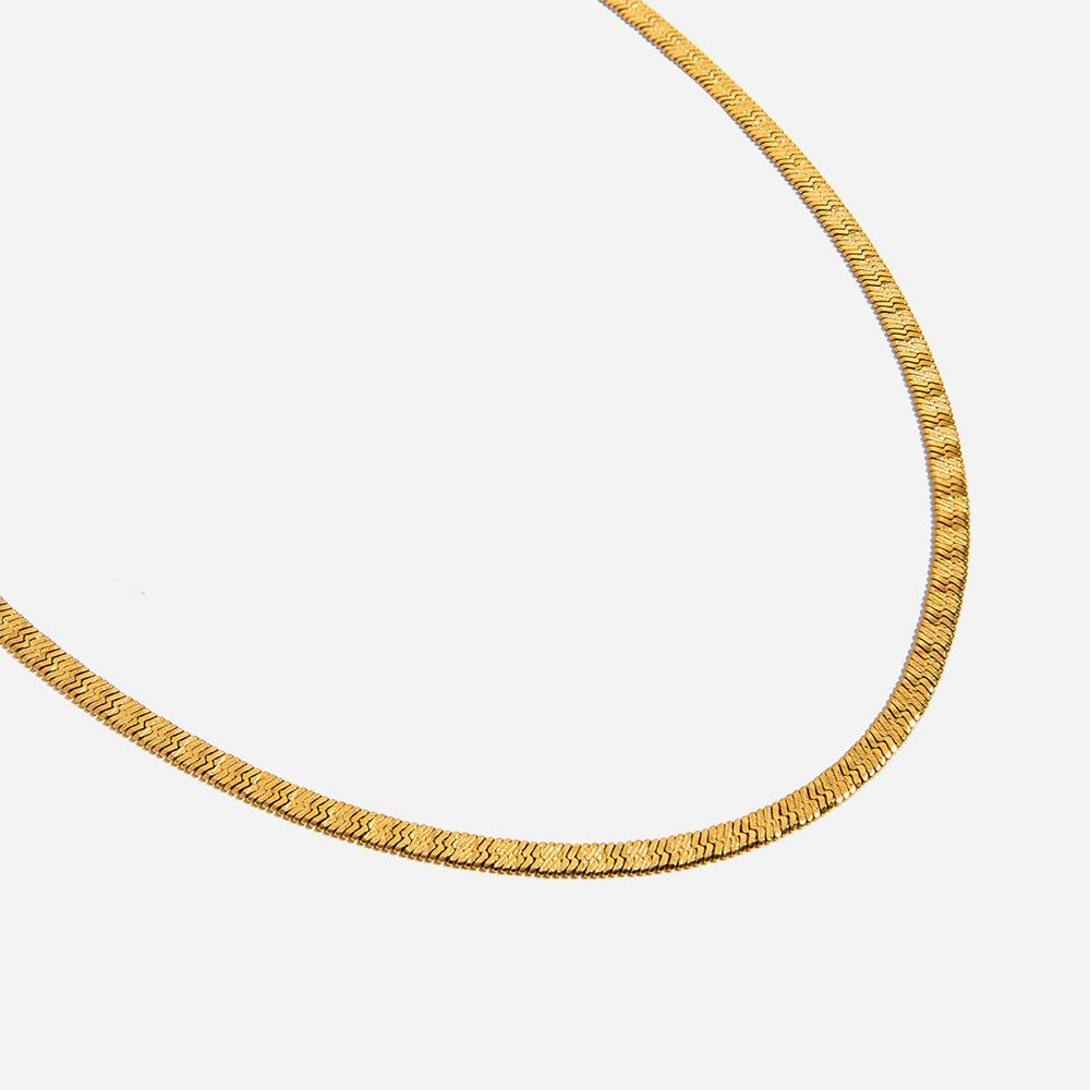 Gold necklace on a white background