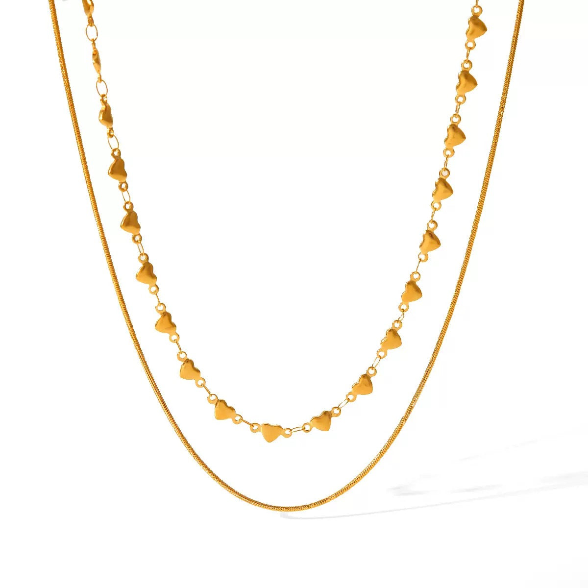 Gold necklace with heart-shaped links on a white background