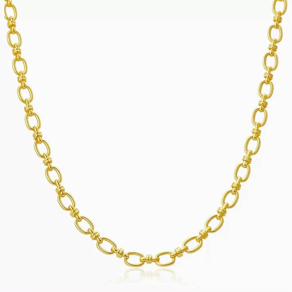 Gold chain necklace on a white background
